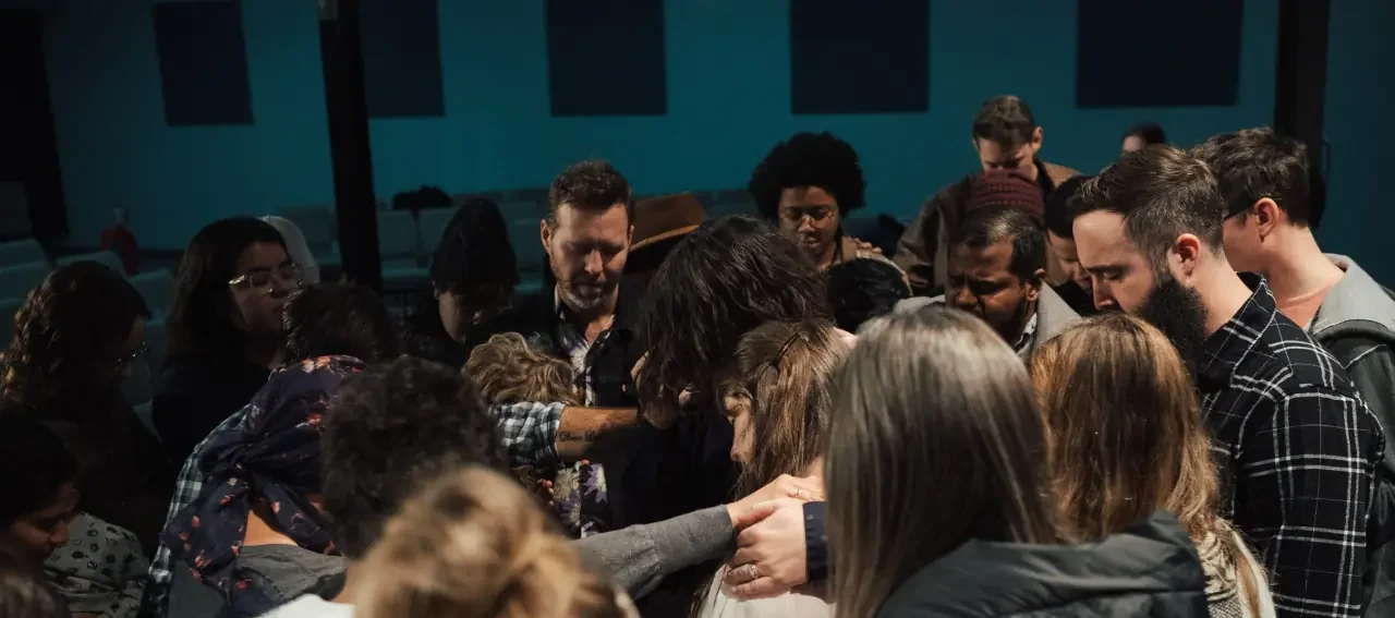 Adult ministry praying for each other