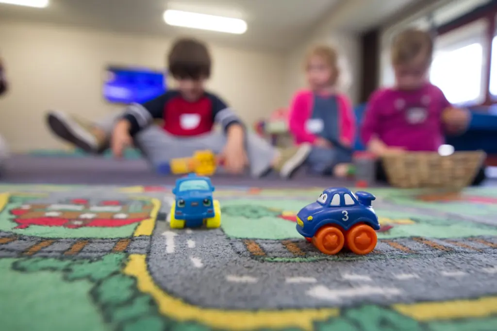 Kids blurred playing with toys from foster closet